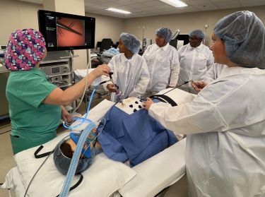 Students practice with technology in the operating room during the Nurses are Extraordinary program.